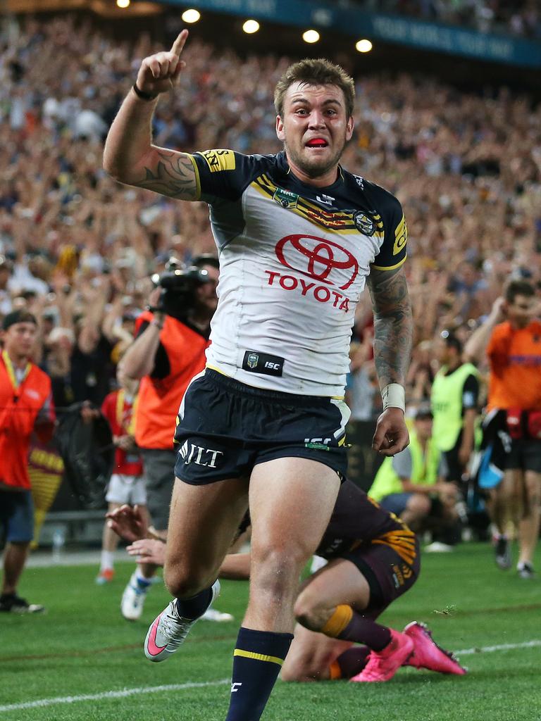 Feldt celebrates as Darius Boyd slumps to his knees in the background.