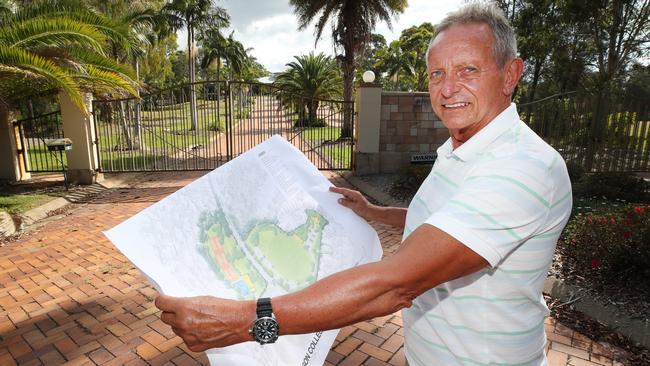 Arundel Estates spokesman and developer Dale Carroll with the plans for the former Arundel Hills Country Club site. Picture: Glenn Hampson