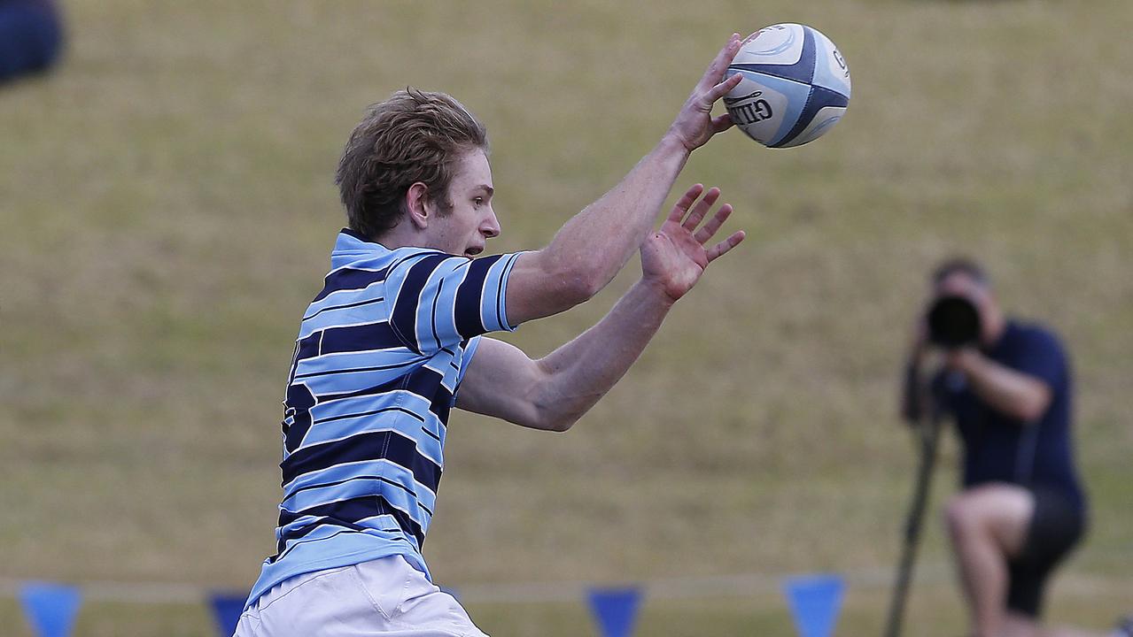 GPS1's Max Jorgensen gets the ball away. ISA1 (black and gold) v GPS1 (Blue and white). Action from game. Junior Rugby. NSW Schools Rugby union trials at Eric Tweedale Oval. Picture: John Appleyard