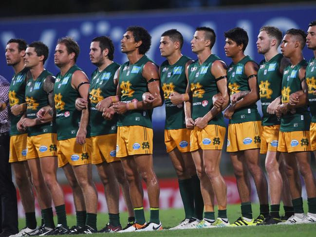 St.Mary's Premier League squad links arms as part of the 'No More' campaign ahead of their Grand Final match against the Wanderers.