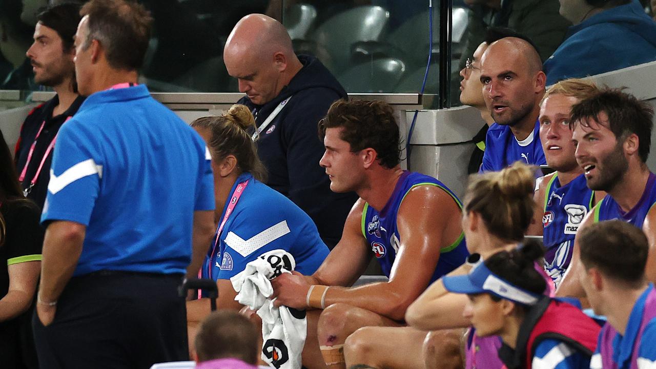 Ben Cunnington of the Kangaroos on the bench after being subbed out. Pic: Michael Klein