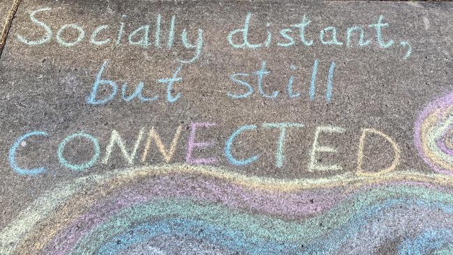 A chalk message on the footpath at Arana Hills.