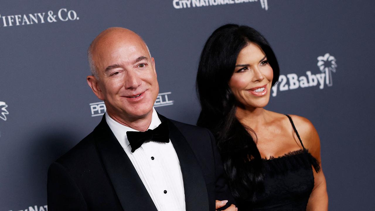 Lauren Sanchez, pictured with partner Jeff Bezos, revealed that she was once rejected for a job as a flight attendant because of her weight. Picture: Michael Tran/AFP