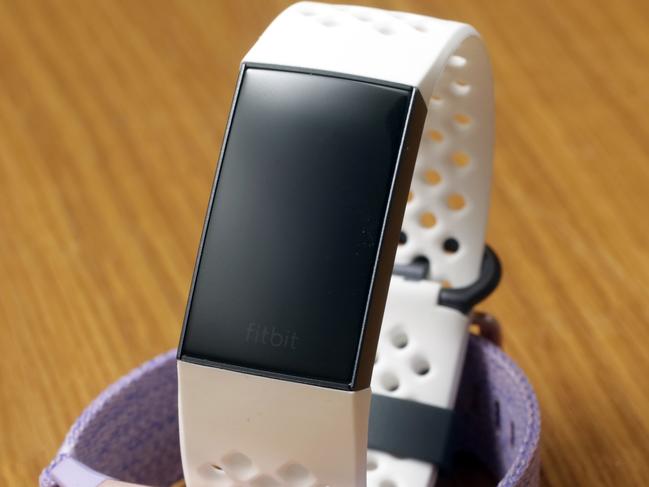 FILE - In this Aug. 16, 2018, file photo, the new Special Edition Fitbit Charge 3 fitness trackers are displayed in New York. Fitbit reports financial results Wednesday, Nov. 6. (AP Photo/Richard Drew, File)