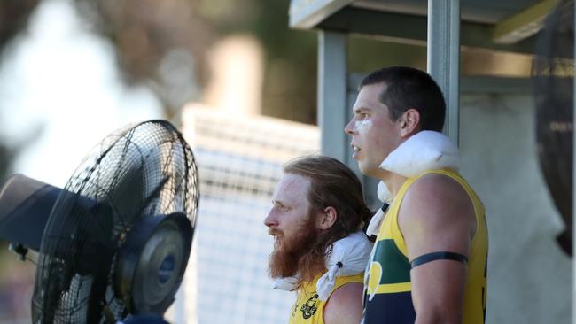 Eagles Angus Poole and Marc Borholm resting from the heat of battle. Picture: Dylan Coker.