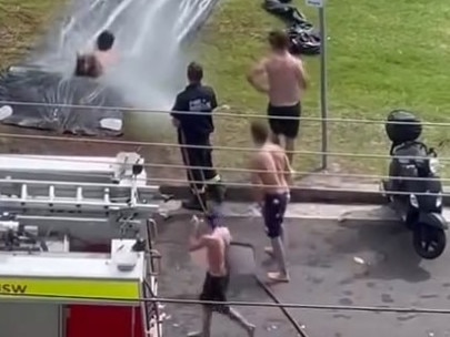 NSW Fire and Rescue helps out with the Australia Day slip and slide at Freshwater.