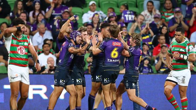 MELBOURNE, AUSTRALIA - MARCH 17: Ryan Papenhuyzen of the Storm celebrates a try with team mates during the round two NRL match between the Melbourne Storm and the South Sydney Rabbitohs at AAMI Park, on March 17, 2022, in Melbourne, Australia. (Photo by Kelly Defina/Getty Images)