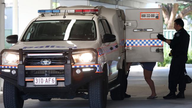 A woman is led away by police after an alleged assault on Water Street in Cairns in July. Picture: Brendan Radke.