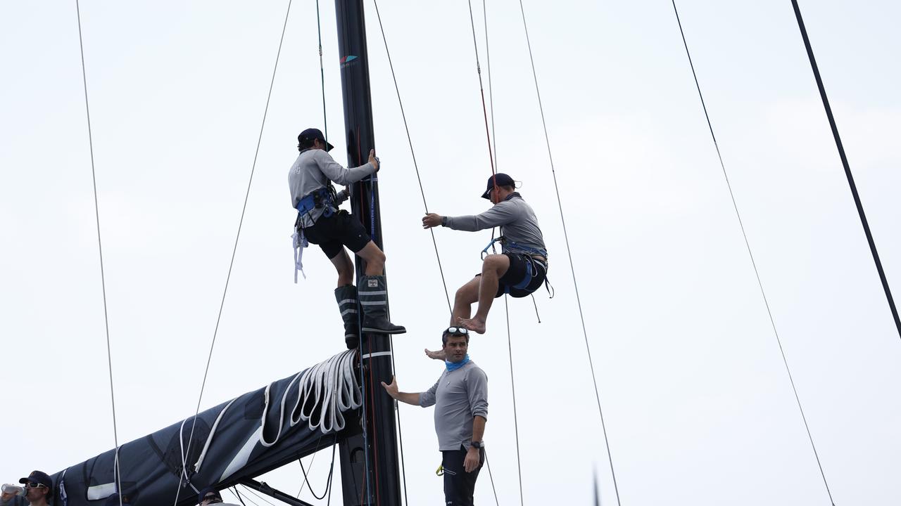 The crew of Highly Sprung checking lines on Sydney Harbour on Boxing Day. Picture: Richard Dobson