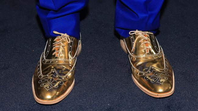 Visy chairman Anthony Pratt's golden brogues in the Furphy marquee on Melbourne Cup day at Flemington Racecourse. Picture: Aaron Francis