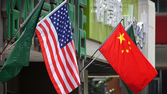 US and Chinese flags outside a hotel in Beijing.