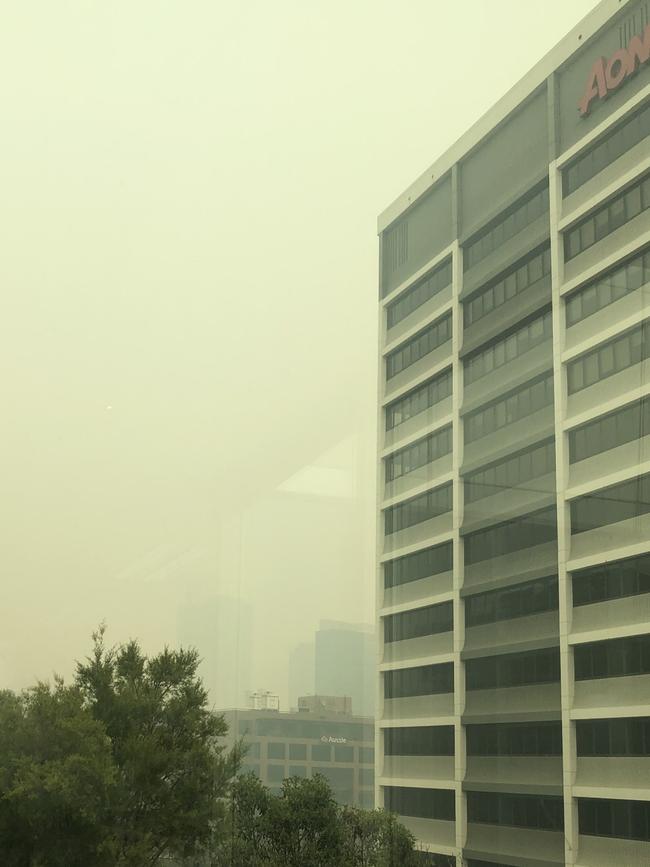 Pollution at Parramatta, as seen from a Phillip St office, shows buildings shrouded in smoke on Tuesday.