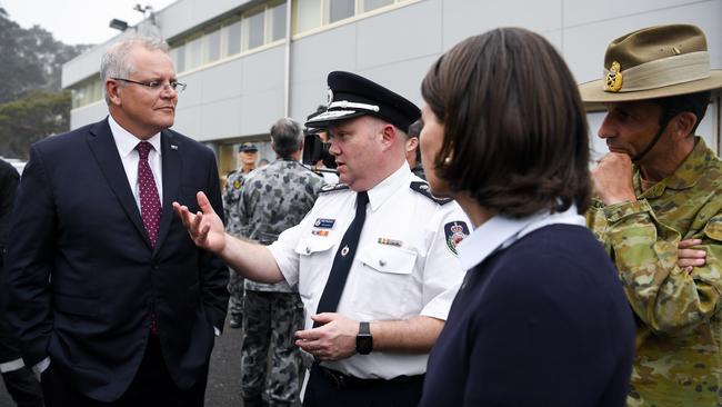 Commissioner Fitzsimmons briefs Scott Morrison with NSW Premier Gladys Berejiklian. Picture: AAP/Lukas Coch