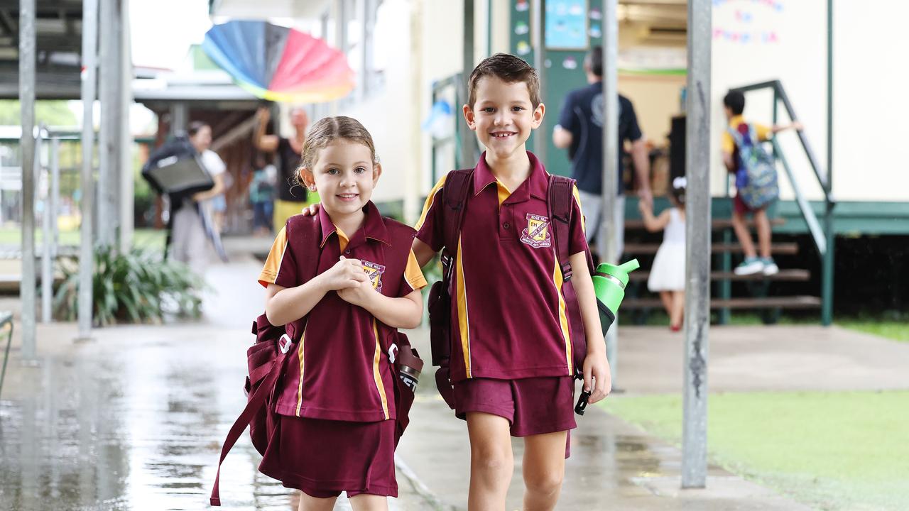 Max Thomas, 6, walks his sister Lyla Thomas, 4, to her prep class on her first day at Edge Hill State School. Picture: Brendan Radke