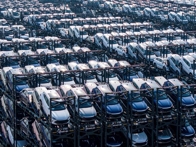 (FILES) BYD electric cars waiting to be loaded onto a ship are seen stacked at the international container terminal of Taicang Port in Suzhou, in Chinaâs eastern Jiangsu province on February 8, 2024. The European Union said this week it would slap additional tariffs of up to 38 percent on Chinese electric car imports from next month after an anti-subsidy probe. (Photo by AFP) / China Out