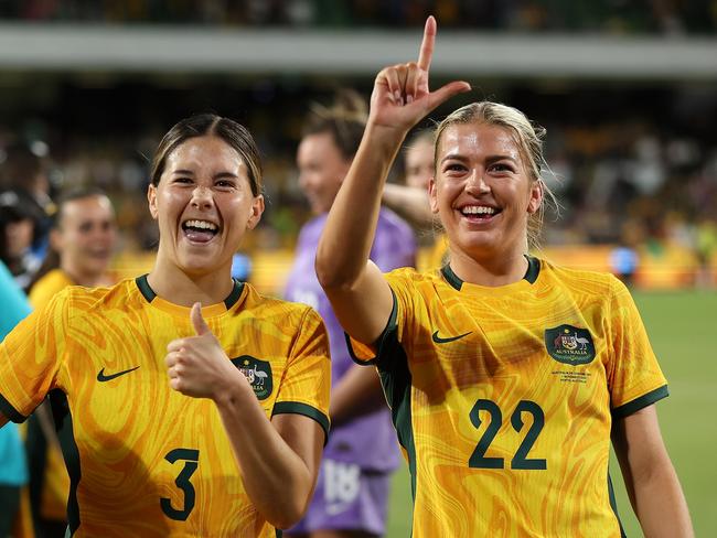 Kyra Cooney-Cross and Charli Grant gesture to the crowd after winning the AFC Women's Asian Olympic Qualifier match between Australia and Chinese Taipei at HBF Park in Perth, Australia. Picture: Getty Images