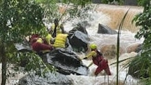 Swift water rescue crews worked to rescue three children from the swollen Woree Creek. Picture: Supplied