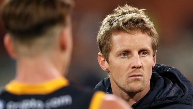 Injured skipper Rory Sloane joins the Adelaide huddle at three quarter time. Picture: Sarah Reed/AFL Photos via Getty Images