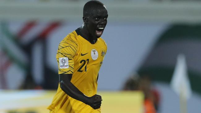 Mabil celebrates his opening goal against Syria. (AP Photo/Hassan Ammar)