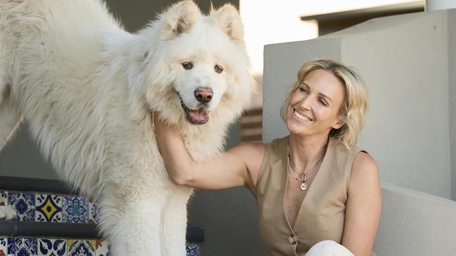 Bec Morse with her dog, Wolfy at home in Henley Beach South, Wednesday, July 19, 2023. Picture: Matt Loxton