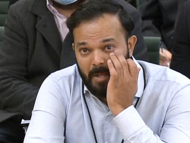 A video grab from footage broadcast by the UK Parliament's Parliamentary Recording Unit (PRU) shows former Yorkshire cricketer Azeem Rafiq fighting back tears while testifying in front of a Digital, Culture, Media and Sport (DCMS) Committee in London on November 16, 2021 as MPs probe racial harassment at the club. - Rafiq appeared before British lawmakers with the chance to give an unvarnished account of his experiences of discrimination at the club that is engulfed in a racism scandal. An independent report found the Pakistan-born player was a victim of "racial harassment and bullying" while Rafiq himself said he had been driven to thoughts of suicide over the way he was treated. (Photo by Handout / PRU / AFP) / RESTRICTED TO EDITORIAL USE - MANDATORY CREDIT "AFP PHOTO /  PRU" - NO MARKETING - NO ADVERTISING CAMPAIGNS - DISTRIBUTED AS A SERVICE TO CLIENTS