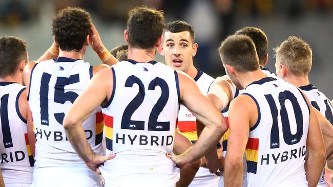 Taylor Walker speaks to teammates at half time. Picture: Michael Dodge/Getty Images