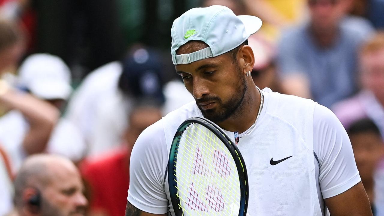 Australia's Nick Kyrgios uses a towel as he plays against US Brandon Nakashima during their round of 16 men's singles tennis match on the eighth day of the 2022 Wimbledon Championships at The All England Tennis Club in Wimbledon, southwest London, on July 4, 2022. (Photo by Glyn KIRK / AFP) / RESTRICTED TO EDITORIAL USE