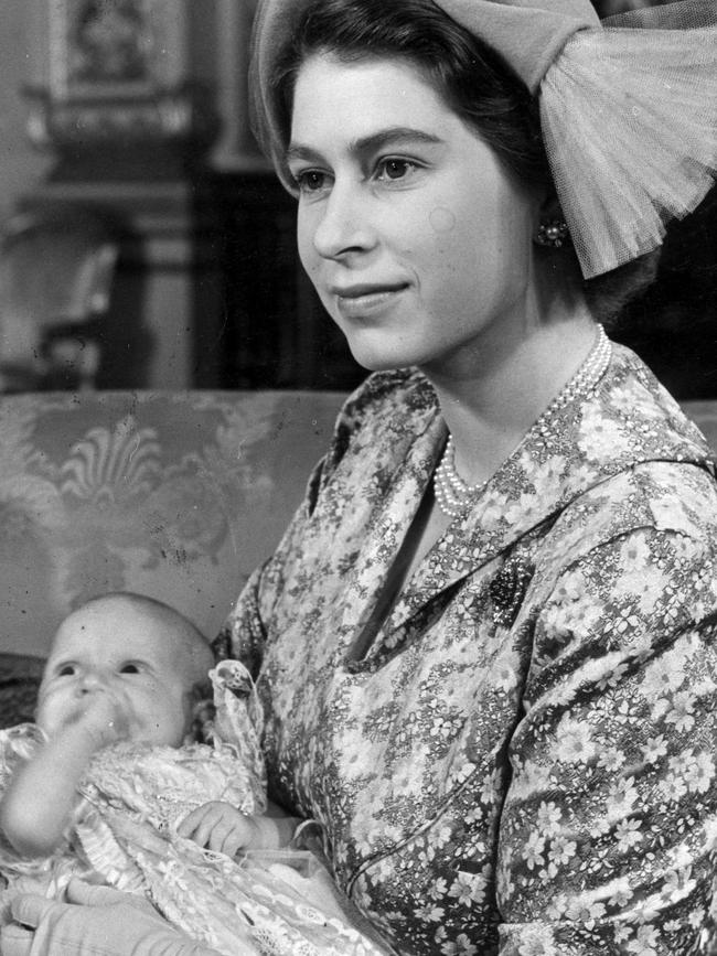 The then Princess Elizabeth (later Queen Elizabeth II) with Prince Charles at his christening.