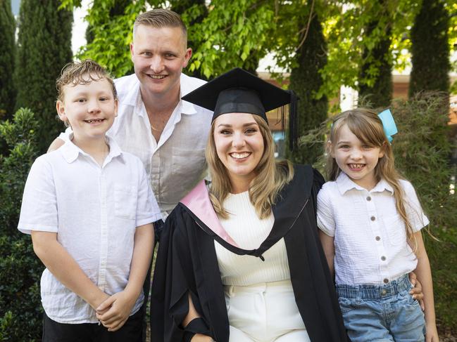 Bachelor of Education (Secondary) with distinction graduate Rebecca Boisen celebrates with family (from left) Archer, Alex and Evie Boisen at a UniSQ graduation ceremony at The Empire, Tuesday, October 29, 2024. Picture: Kevin Farmer