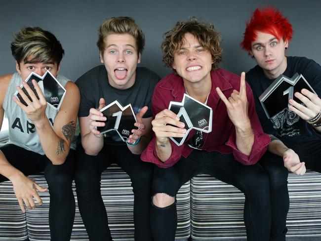 Awards coup ... 5 Seconds of Summer were given their No. 1 trophy for their self-titled debut album yesterday and head home to open the 2014 ARIA Awards in November. Picture: Cameron Richardson