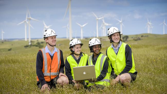 Tenison Woods College students Lachie Price, Made Fatchen, Nadia Munguakonkwa and George Wimhurst at Lake Bonney Windfarm. Picture: Roy Van Der Vegt