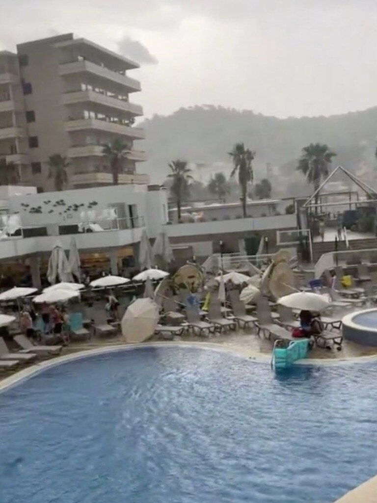 Parasols are blown over after storms hit Majorca. Picture: Solarpix