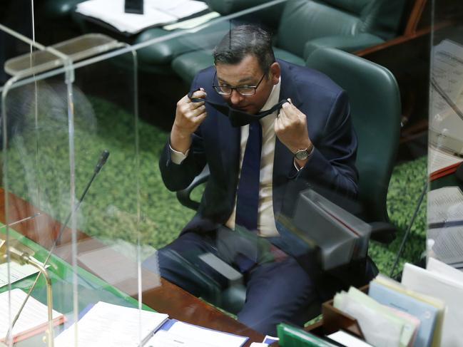 Premier Daniel Andrews removes his mask to speak during Question Time in parliament on October 26, 2021 in Melbourne, Australia. Picture: Darrian Traynor/Getty Images