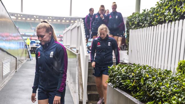 The English team leave the SCG after their match against India was cancelled because of rain therefore putting them out of the World Cup.