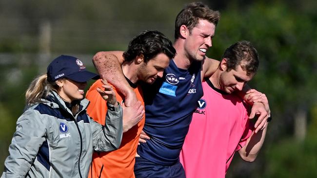 VAFA: Old Melburnians Nick De Steiger is helped off the field. Picture: Andy Brownbill