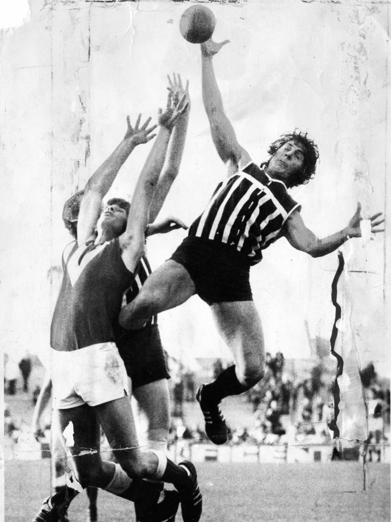 Russell Ebert attempts a mark over teammate Paul Marrett and North Adelaide footballer Rex Eatts in 1974. Picture: Advertiser Library