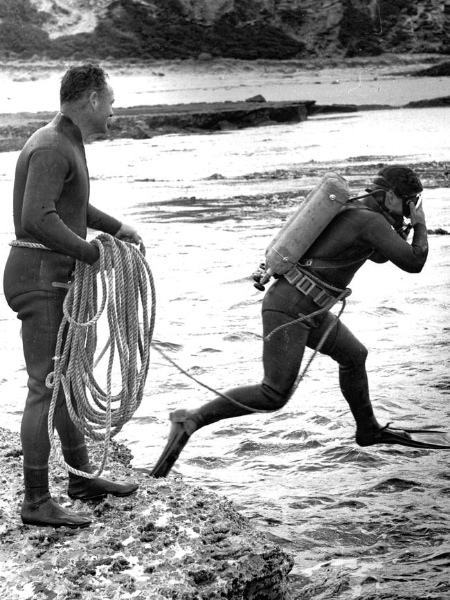 1967: Victoria Police officer John Simon jumps into the water in what was to prove a futile search for Prime Minister Harold Holt, who disappeared off Portsea’s Cheviot Beach. File picture