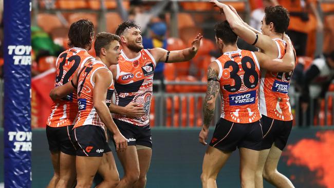 GWS players celebrate one of many goals against the Suns. Picture: Getty Images