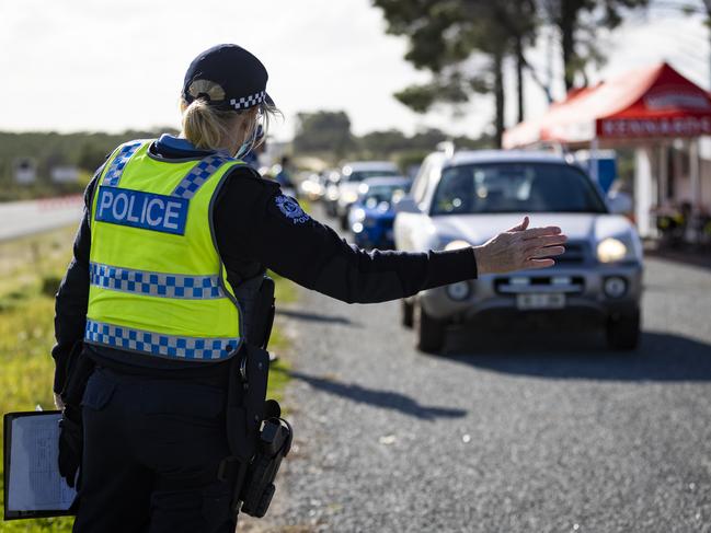 A police officer at a checkpoint north of Perth. Picture: Getty Images