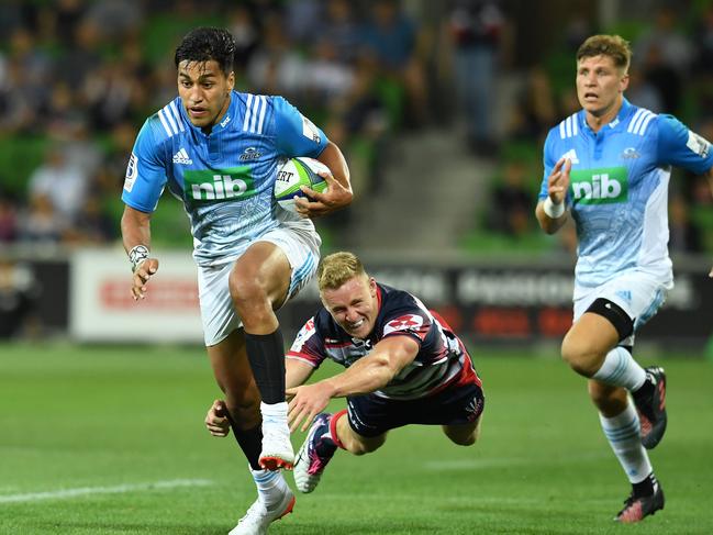 Rieko Ioane of the Blues avoids a tackle to score a try during the round 1 Super Rugby match between the Melbourne Rebels and the Blues at AAMI Park in Melbourne, Thursday, Feb. 23, 2017. (AAP Image/Tracey Nearmy) NO ARCHIVING, EDITORIAL USE ONLY