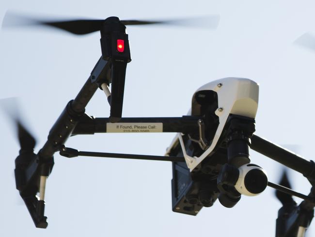 In this Thursday, April 14, 2016, photo, a drone operated by DroneLinx CEO Steve Metzman captures videos and still images of an apartment building, in Philadelphia. DroneLinx, a service based in New York, has a variety of clients who want aerial photos or videos but don't want or need their own aircraft. (AP Photo/Matt Rourke)