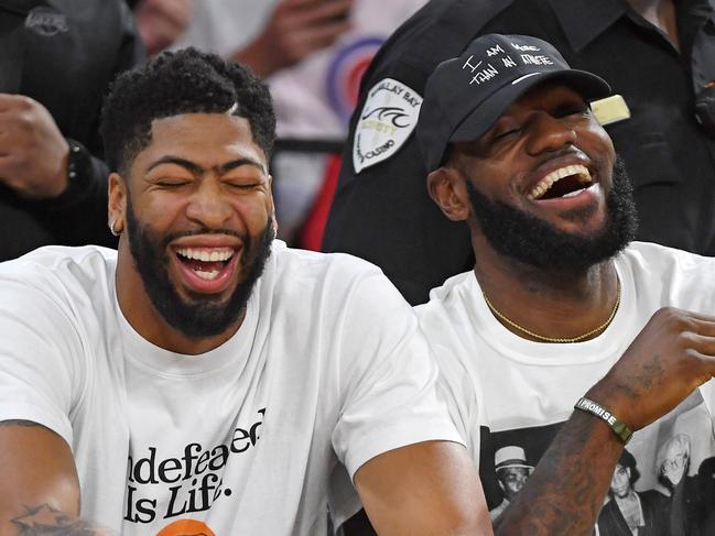 LAS VEGAS, NEVADA - SEPTEMBER 24:  Anthony Davis (L) and LeBron James of the Los Angeles Lakers laugh while attending Game Four of the 2019 WNBA Playoff semifinals between the Washington Mystics and the Las Vegas Aces at the Mandalay Bay Events Center on September 24, 2019 in Las Vegas, Nevada. The Mystics defeated the Aces 94-90 and won the series 3-1. NOTE TO USER: User expressly acknowledges and agrees that, by downloading and or using this photograph, User is consenting to the terms and conditions of the Getty Images License Agreement.  (Photo by Ethan Miller/Getty Images)