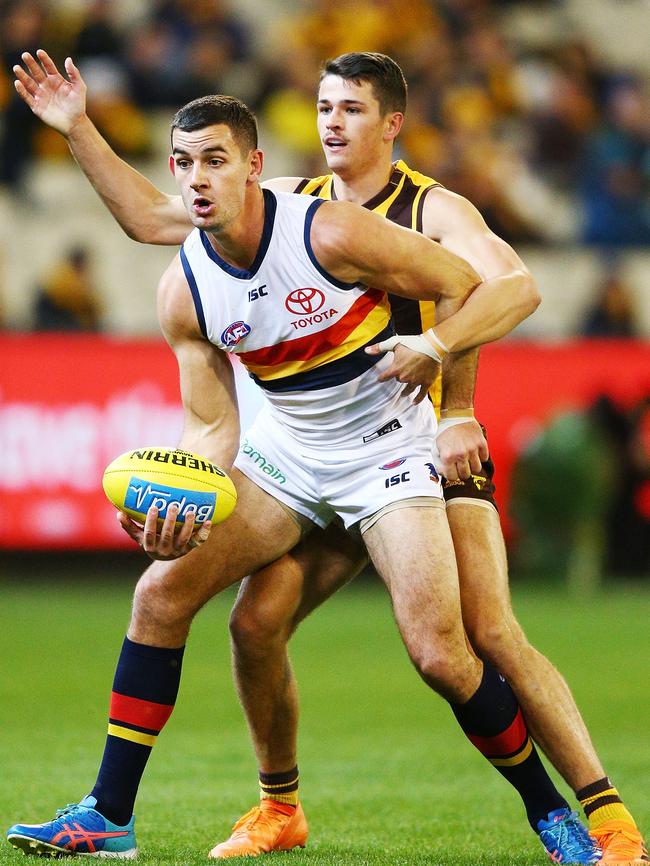 Taylor Walker marks ahead of Hawthorn’s Ryan Burton on Saturday night. Picture: Michael Dodge/Getty Images