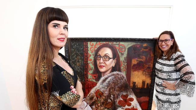 Sarah Hickey with her subject Anita Heiss and painting that is entered in the Brisbane Portrait Prize. Pictures: Steve Pohlner