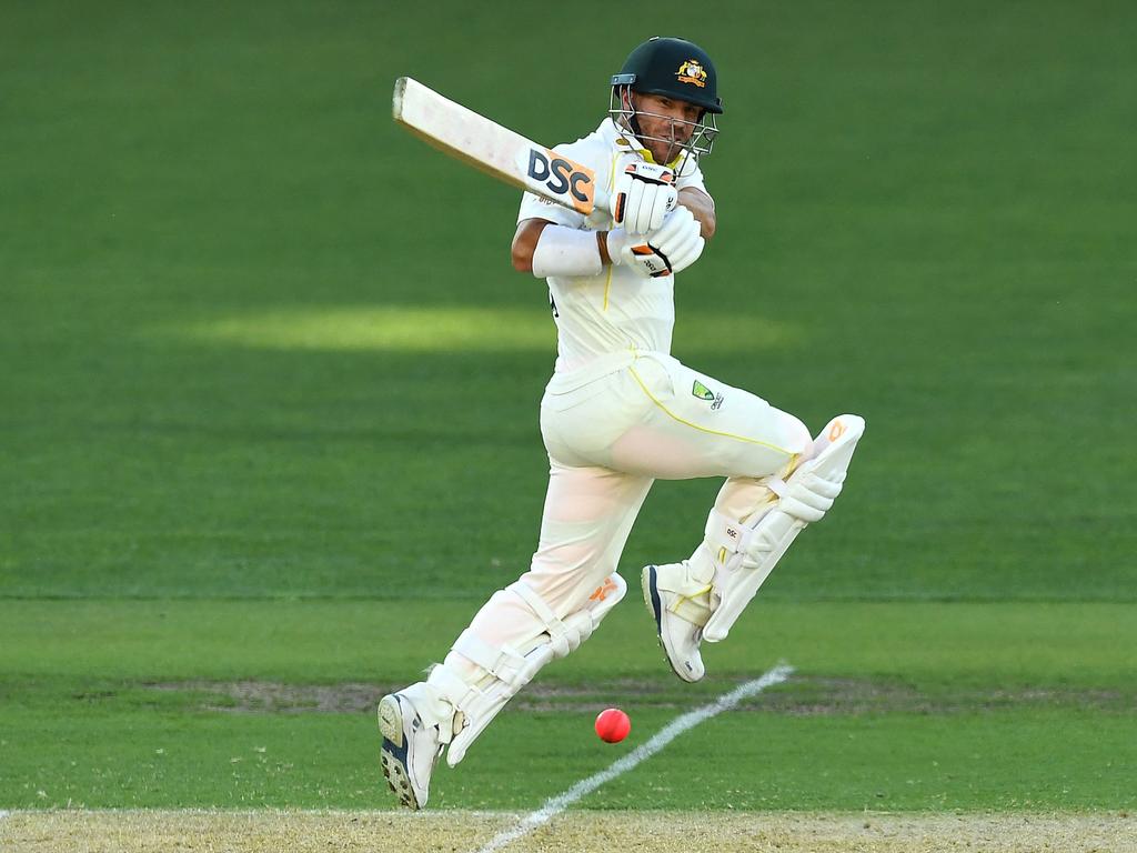 David Warner played through the pain barrier to bring up a wonderful 95 against a persistent England bowling attack on Day 1 in Adelaide. Picture: William West/AFP