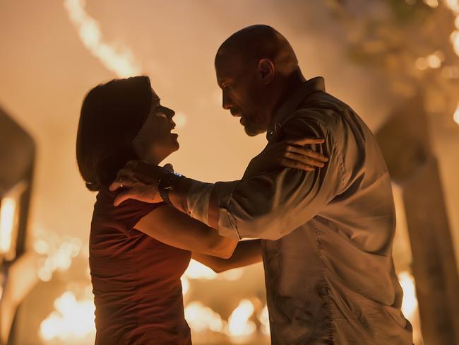 Neve Campbell with Dwayne Johnson in <i>Skyscraper. </i>Picture: Universal Pictures