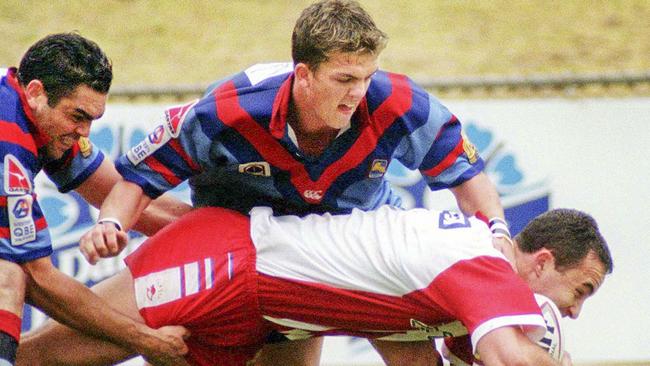 Toowoomba Clydesdale Ned Murphy tackles a Redcliffe Dolphins player. Photo: Contributed