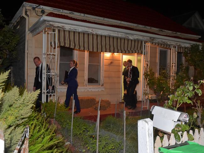 AFP officers raid a Brunswick property on Thursday night. Picture: Jay Town