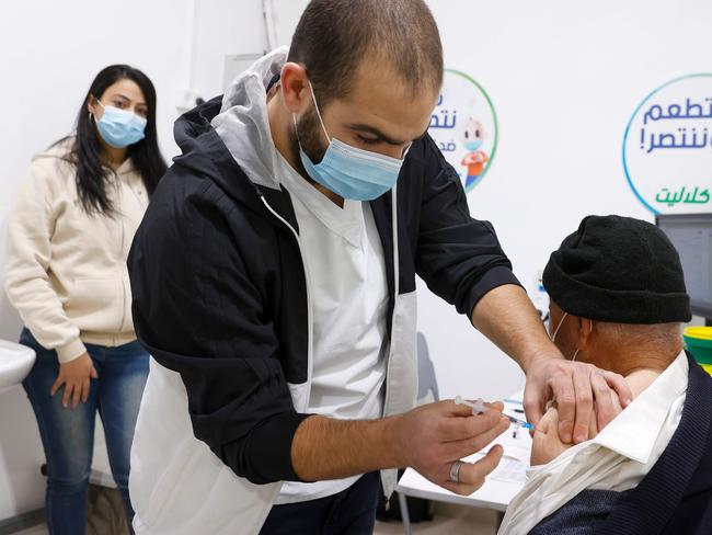 A healthcare worker administers a COVID-19 vaccine in the northern Arab Israeli city of Umm al Fahm. Picture: AFP