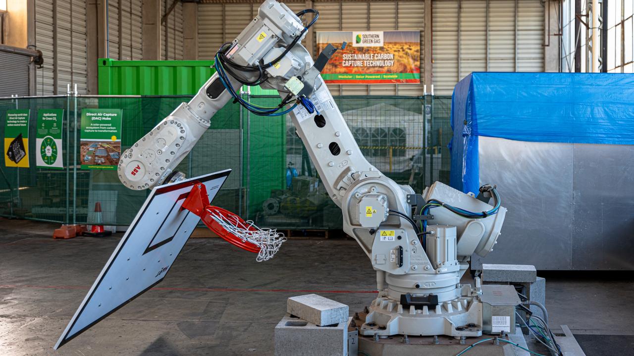 A moving basketball hoop controlled by a robotic arm.